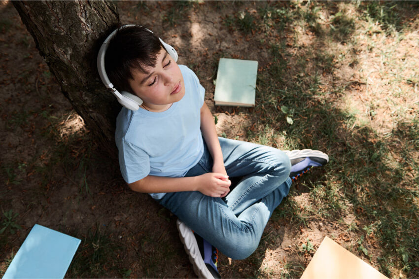 boy listening to audiobook.