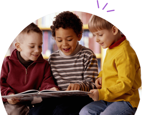 Three young boys reading.