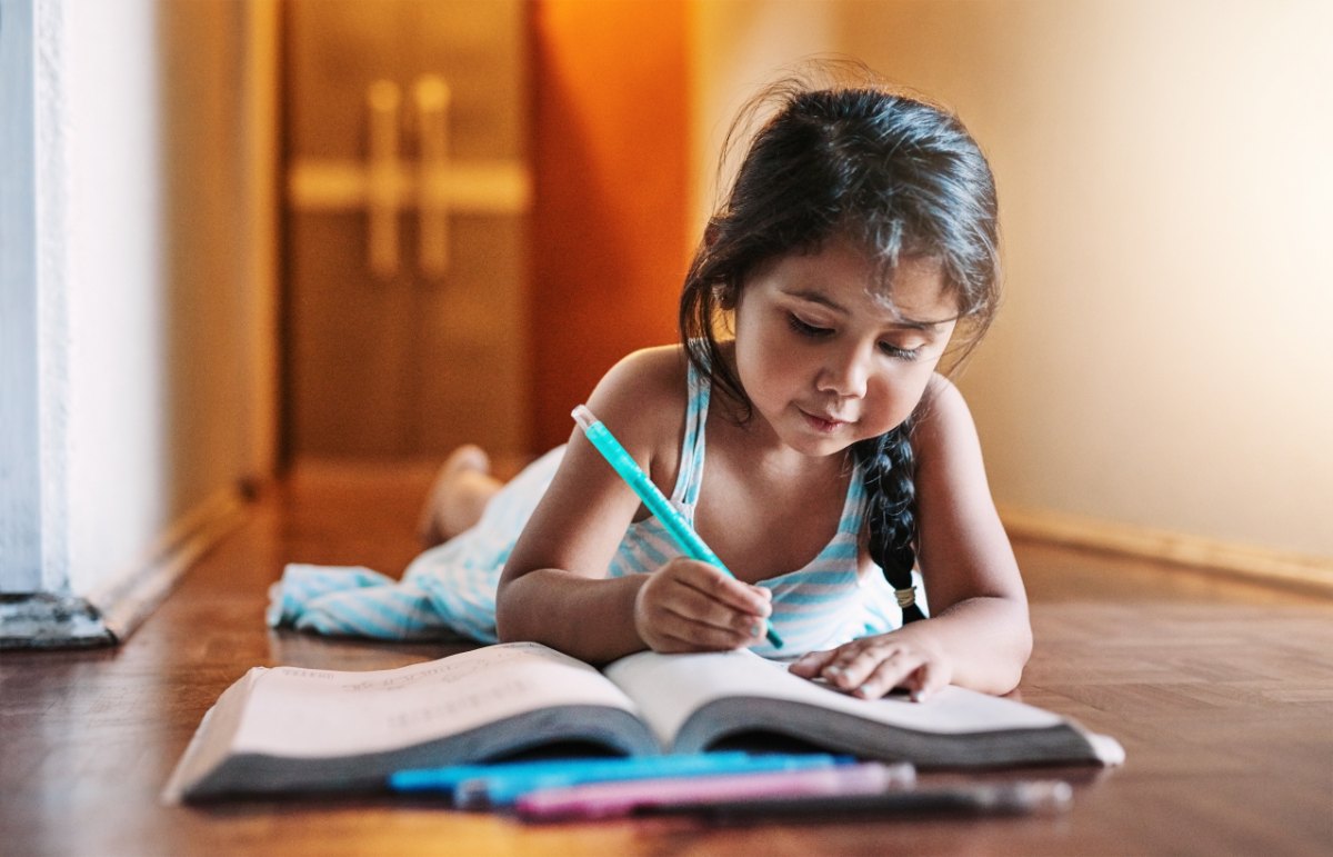 young girl writing.
